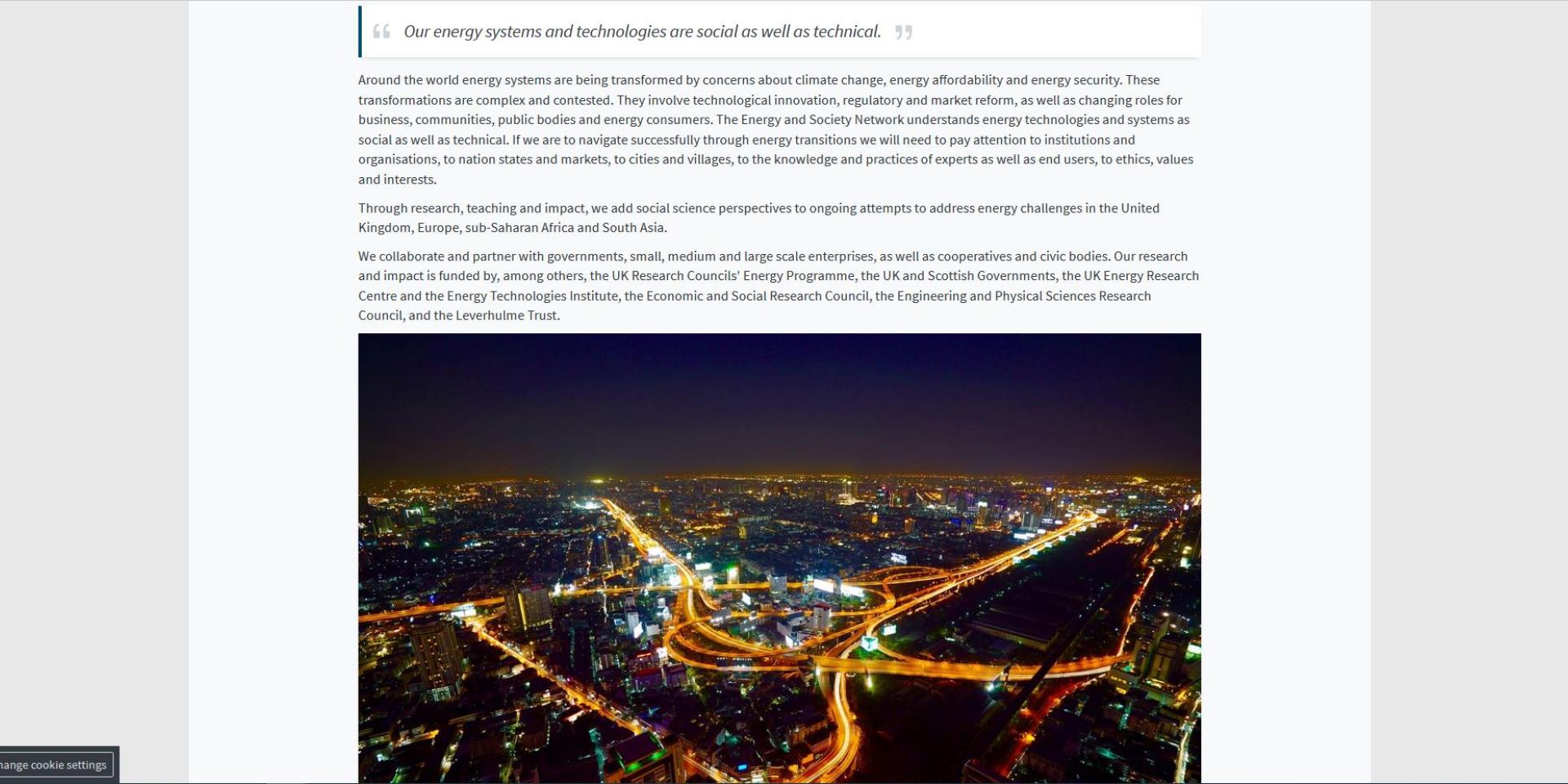 A screenshot of a generic content page with body text, a short block quote, and a photo of an illuminated city at night taken from above.