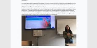 A screenshot of a news webpage with a summary, body text, an image of a woman giving a presentation at a conference, and links to the social media of her research area.