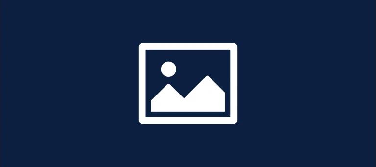 A white icon depicting a picture in a picture frame on a navy background.