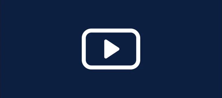 A white graphic icon of a play button on a navy background.