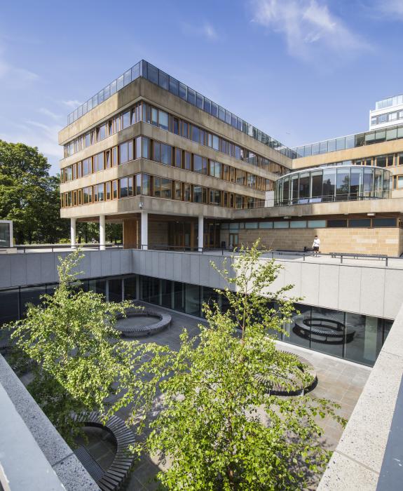 A view of the 50 George Square building on central campus, looking across the lower courtyard of the neighbouring 40 George Square in the foreground. The image is displayed in portrait orientation with 575x700 pixel dimensions.